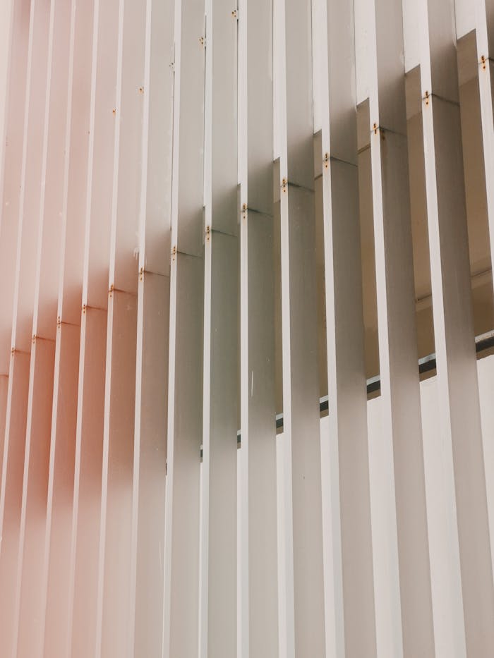 gallery-03 Vertical aluminum slats creating a modern geometric architectural design in minimalist style.
