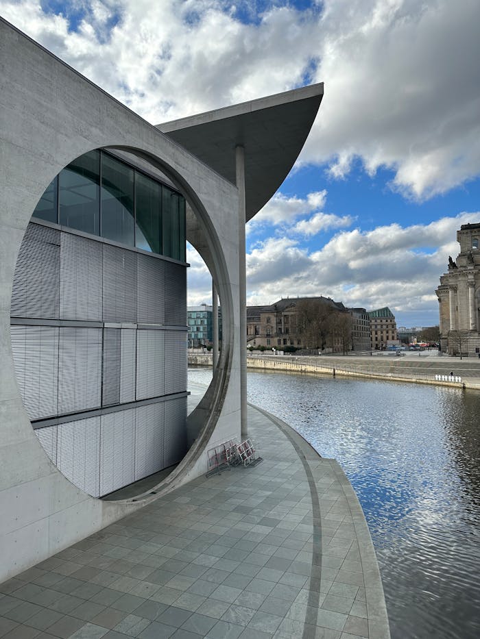 portfolio-01 Stunning view of Berlin's modern architecture by the Spree River, showcasing urban elegance.
