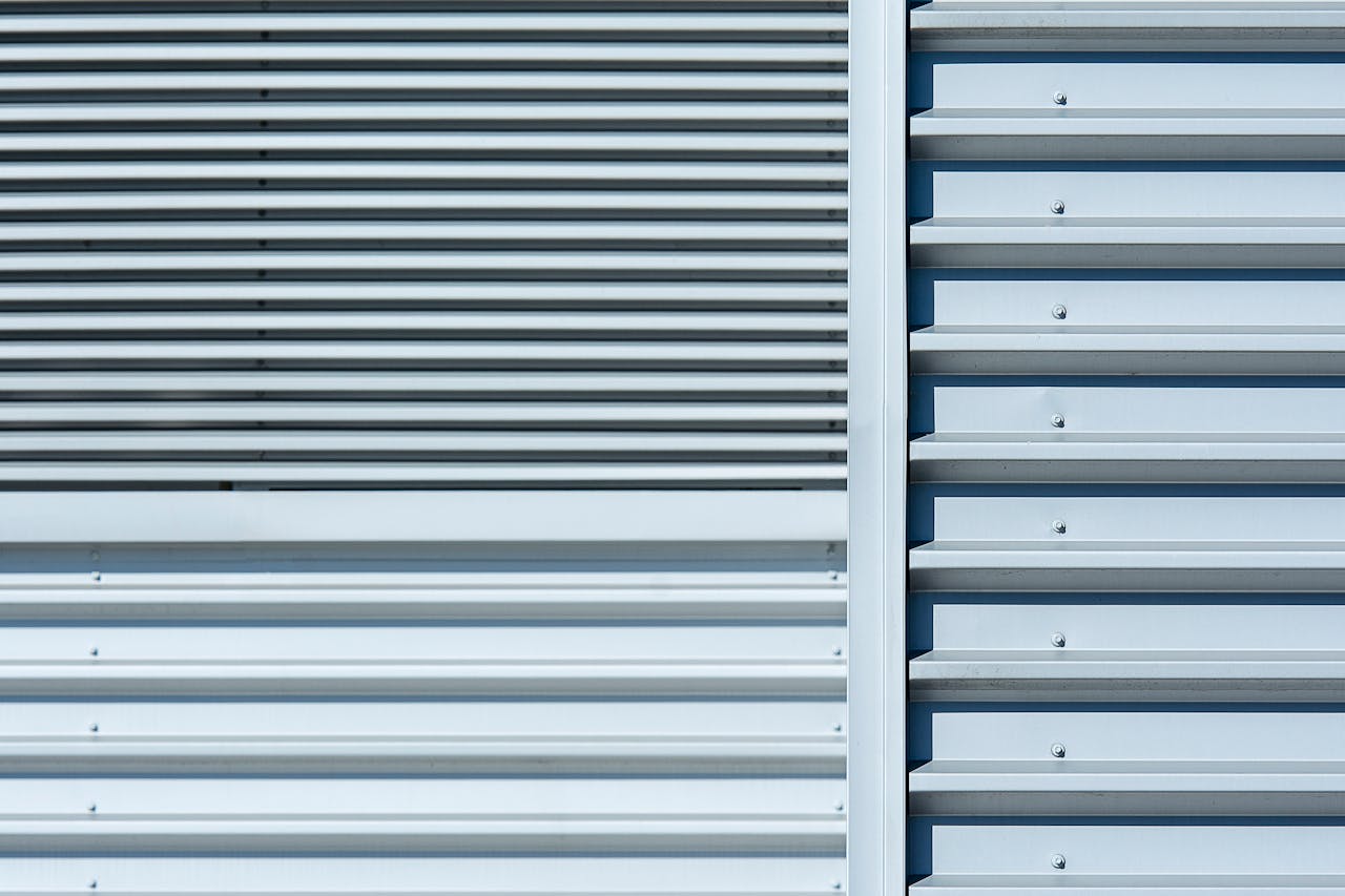 gallery-02 Abstract photo of a metal wall with horizontal, parallel lines and industrial texture.